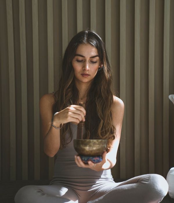 Woman in a calm, focused state, representing inner peace and rhythm.